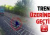 Tren raylarına yattı, tren üzerinden geçti